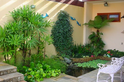 Jardins decorados com palmeiras